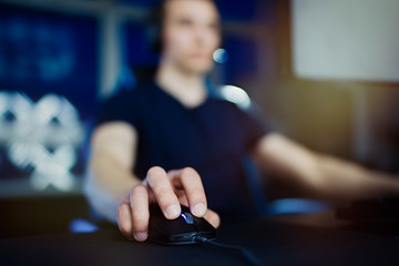 Close up of hands gamer playing in the video game using keyboard and mouse                               