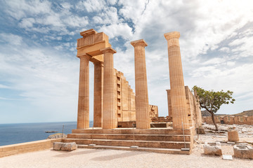 Famous tourist attraction - Acropolis of Lindos. Ancient architecture of Greece. Travel...