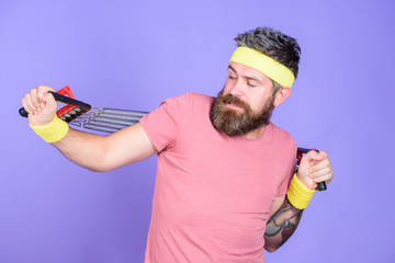 Athlete stretching with expander. Sportsman training stretching expander. Man bearded athlete exercising with expander equipment. Try stretching exercise. Athlete sport instructor. Lets stretch arms