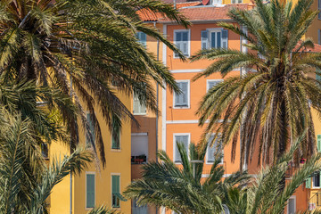 Fototapeta na wymiar Colorful houses in old town architecture of Menton on French Riviera. Provence-Alpes-Cote d'Azur, France.