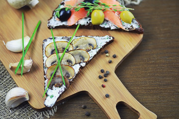 Assorted sandwiches with different fillings, fish mushrooms and others