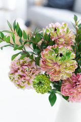 Bouquet of beautiful pink and green ranunculus flowers