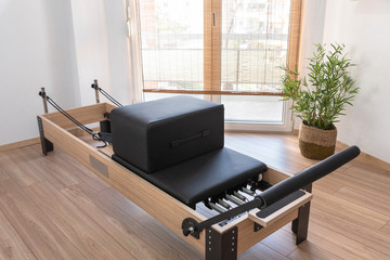 Pilates studio room with reformer beds