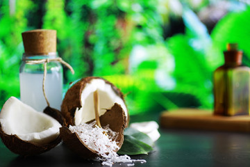 Coconut on a dark stone table. Coconut oil.