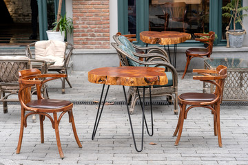 Table and chairs in street cafe, close up
