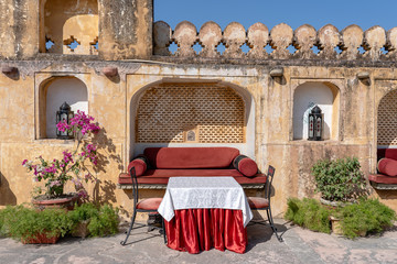 A cozy seating area with a sofa table and chairs in Jaipur, Rajasthan, India