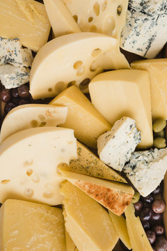 Collection of fresh cheese slices with olives
