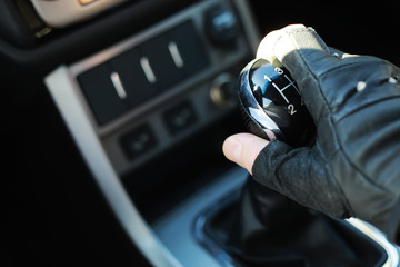 Gear lever. Manual Transmission. Hand on the gear shift in a car.
