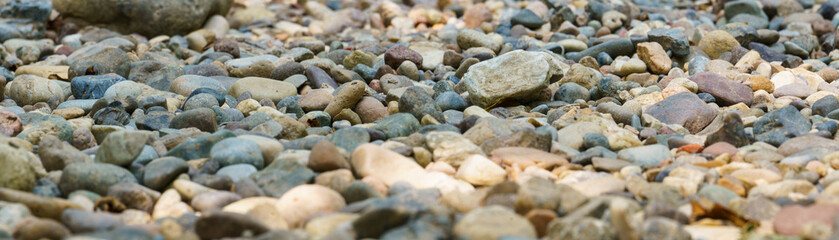 Panoramic view of the dried riverbed. A dry river bed of gravel.