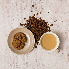 Obraz na płótnie Canvas Coffee beans, cookies and coffee cup