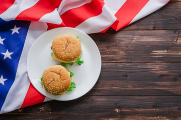 American hamburger or cheeseburger with america flag for USA 4th of July independence day food background concept