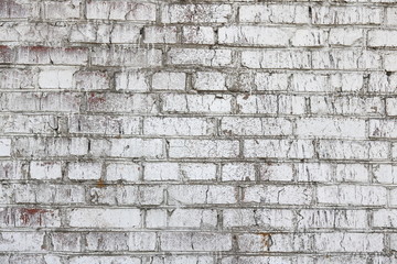 Old wall made of red brick, painted white in loft style for modern designer interior of room, bar or restaurant