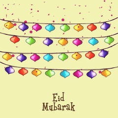 Greeting card with colorful lights for Eid Mubarak.