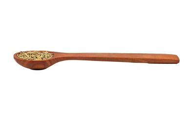 Dry rosemary in a spoon