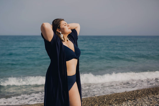 Female fashion model posing in bikini on the beach – Jacob Lund Photography  Store- premium stock photo