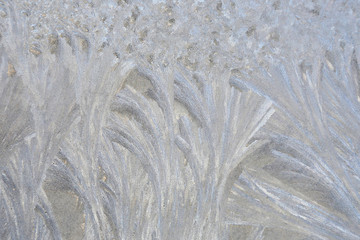 ice patterns on frozen window. winter season.