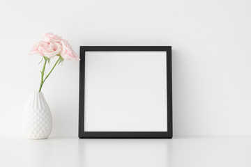 Black square frame mockup with soft pink roses in a vase.