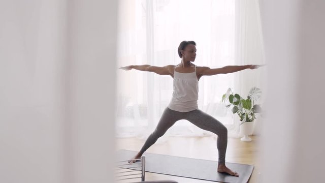 Woman exercising in living room
