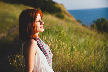 Fototapeta premium Girl at hill in sunrise.
