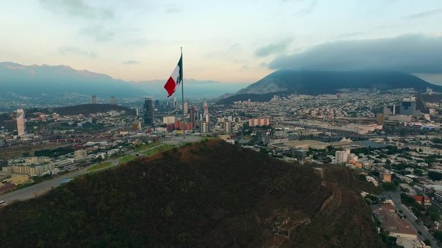 Aerial shot of the Mexican flag in the Obispado Hill in Monterrey Mexico.