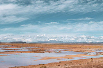 Fototapeta na wymiar Endless landscapes with reflection like mirror of sky in Salar de Uyuni, Bolivia