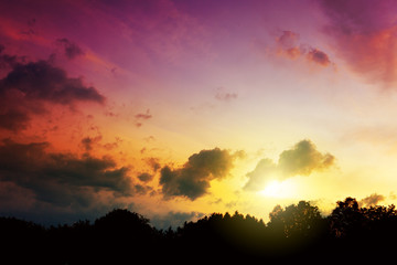 Colorful dramatic sky with big clouds at sunset.