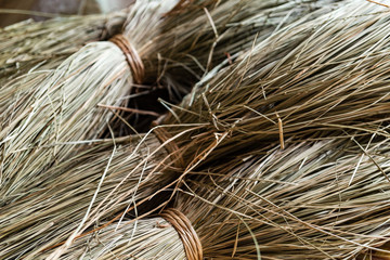 Close-up on sacks of straws for sedge mat weaving in Ben Tre, Mekong delta region, Vietnam. Horizontal view