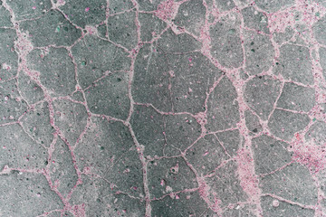 Stone cracked surface of gray, pink tones. Old stone floor.