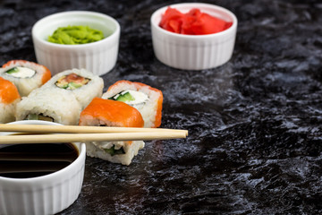 Set of sushi and maki on stone table. copy space