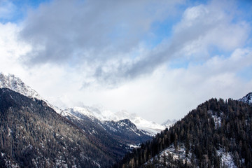 Obraz na płótnie Canvas Snow-capped mountains in Trentino Alto Adige. Mountains in winter. Winter landscape in the Alps Mountains, Moena, Val di Fassa.