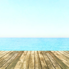 Table top with sea background, sky and cloud in sunny day for product display job showing. Wooden table for display or montage your products.