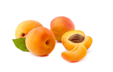 Apricots with leaf on white background closeup