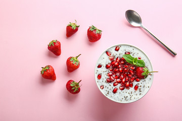 Bowl with tasty chia dessert on color background