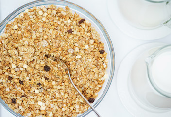 Bowl of nuts, dried fruit and muesli for the preparation of a nutritious vegetarian breakfast. 