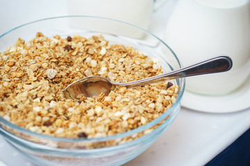 Bowl of nuts, dried fruit and muesli for the preparation of a nutritious vegetarian breakfast. 