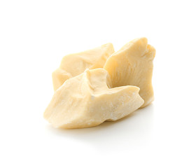 Pieces of cocoa butter on white background