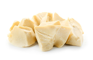 Pieces of cocoa butter on white background