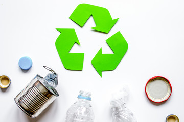 waste recycling symbol with garbage on white background top view mock up
