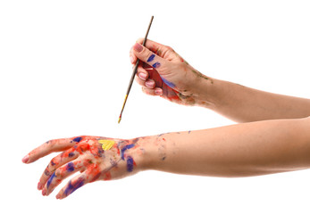 Painted female hands with brush on white background