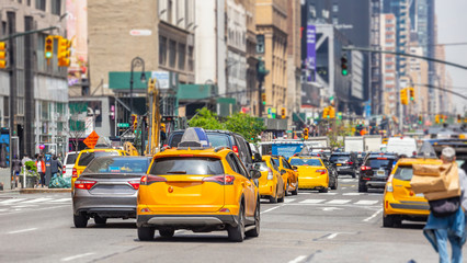 Fototapeta na wymiar New York, streets. High buildings, cars and cabs