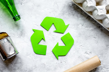 environment concept with recycling symbol on stone background top view