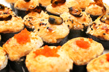 Sushi and rolls with cheese mussels and caviar close-up