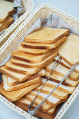 Bread, sandwiches, pies on the table prepared for guests and participants of the event. 
