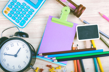 flat lay top view shot, scattered home office workspace or desk concept with accessories and stationery