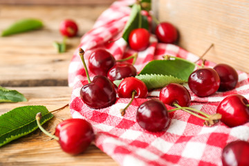 Sweet ripe cherry on wooden table