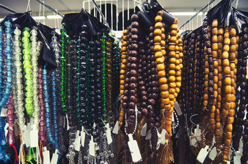 Selection of traditional prayer beads or tasbih on display for sale