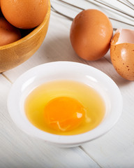 Fresh egg yolks in a porcelain bowl