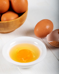Fresh egg yolks in a porcelain bowl