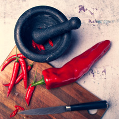 mortar and pestle with red pepper