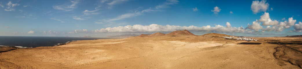 Aerial view of a desert landscape on the island of Lanzarote, Canary Islands, Spain. Mountains of...